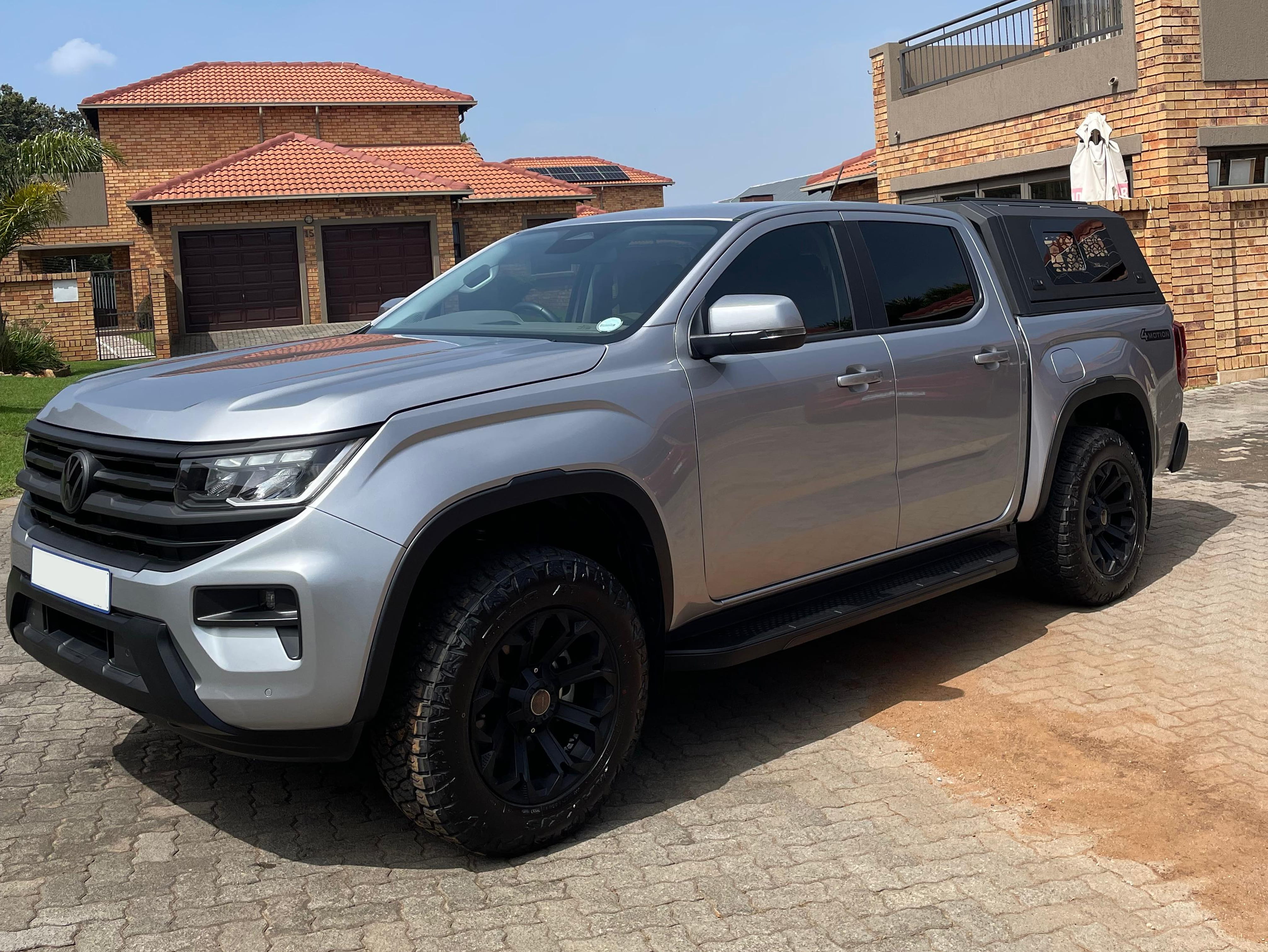 Freshly detailed car exterior with mirror-like paint finish